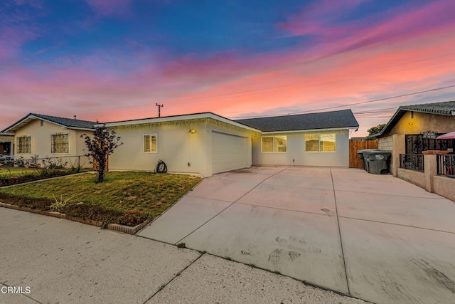 124 N Driskill St, Oxnard, CA 93030 - ranch-style home with driveway, a garage, and stucco siding