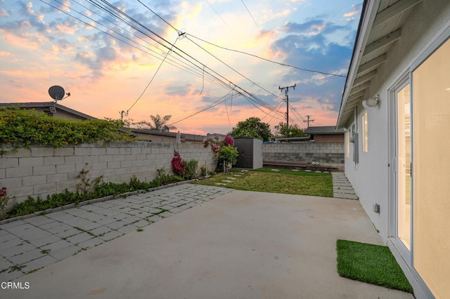 124 N Driskill St, Oxnard, CA 93030 - patio terrace at dusk with a fenced backyard and a patio area
