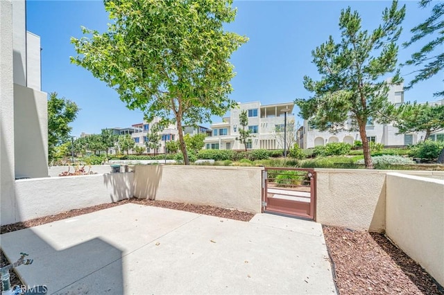 143 Frame, Irvine, CA 92618 - view of patio featuring a fenced front yard, a residential view, and a gate