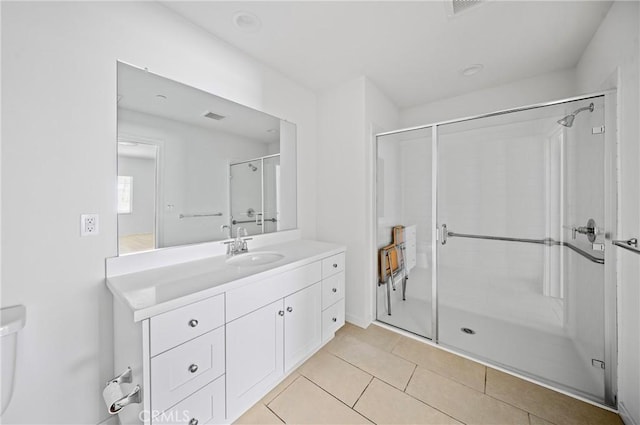 143 Frame, Irvine, CA 92618 - bathroom with vanity, a stall shower, tile patterned floors, and toilet