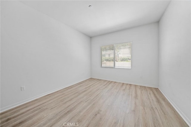 143 Frame, Irvine, CA 92618 - empty room featuring light wood finished floors and baseboards