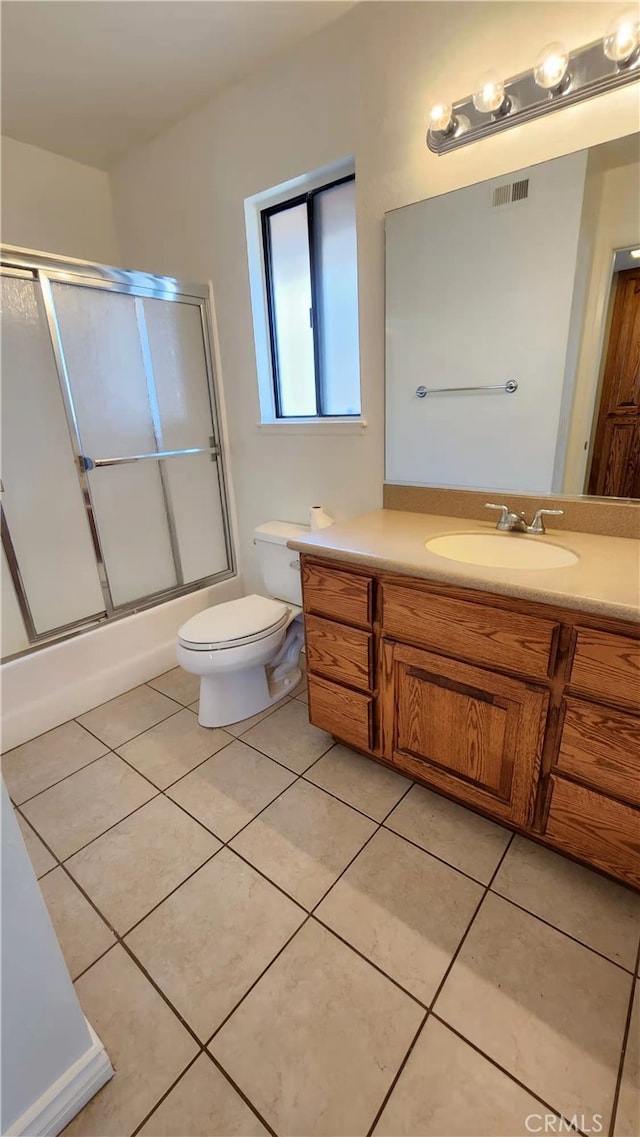 7240 Meadowlark Pl, Rancho Cucamonga, CA 91701 - full bath with vanity, toilet, tile patterned floors, and bath / shower combo with glass door