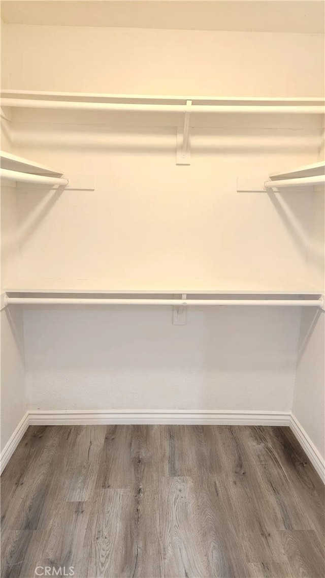 7240 Meadowlark Pl, Rancho Cucamonga, CA 91701 - spacious closet featuring wood finished floors