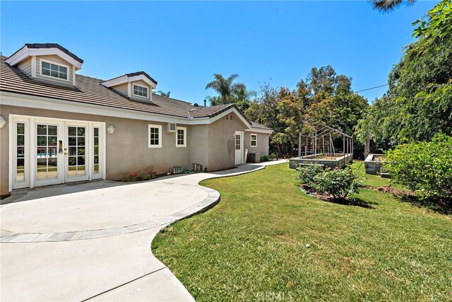 5571 Mountain View Ave, Yorba Linda, CA 92886 - view of grassy yard with a patio and french doors
