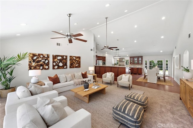 5571 Mountain View Ave, Yorba Linda, CA 92886 - living area with high vaulted ceiling, ceiling fan, recessed lighting, and light colored carpet