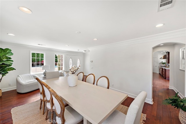 5571 Mountain View Ave, Yorba Linda, CA 92886 - dining area featuring dark wood-style flooring, arched walkways, ornamental molding, recessed lighting, and baseboards