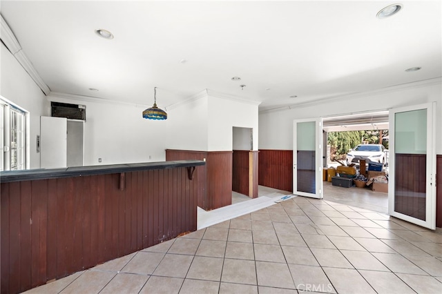 5571 Mountain View Ave, Yorba Linda, CA 92886 - kitchen featuring crown molding, a wainscoted wall, dark countertops, wooden walls, and light tile patterned flooring
