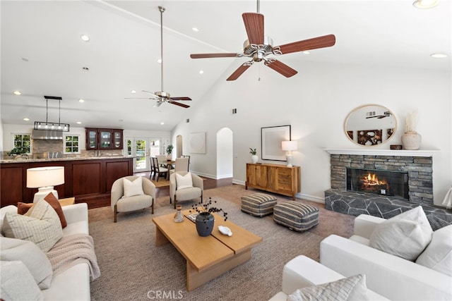 5571 Mountain View Ave, Yorba Linda, CA 92886 - living area featuring a fireplace, recessed lighting, arched walkways, high vaulted ceiling, and ceiling fan