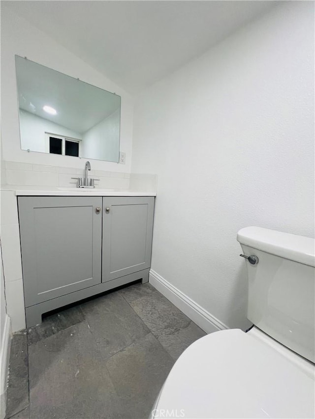1385 N San Pablo Ave, Fresno, CA 93728 - bathroom featuring toilet, vanity, and baseboards