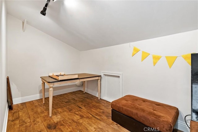 9900 Carmelita Ave, Atascadero, CA 93422 - office area featuring vaulted ceiling, wood-type flooring, track lighting, and baseboards