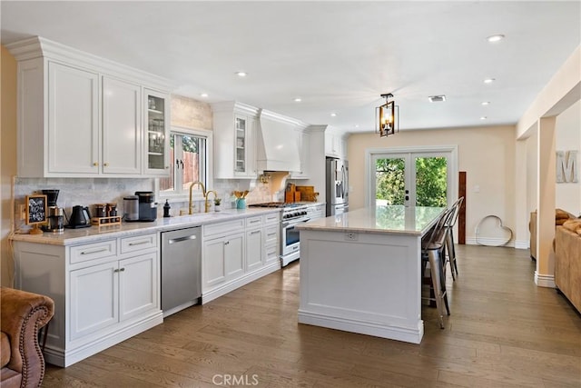 9900 Carmelita Ave, Atascadero, CA 93422 - kitchen with stainless steel appliances, a sink, premium range hood, healthy amount of natural light, and recessed lighting