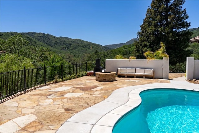 9900 Carmelita Ave, Atascadero, CA 93422 - view of swimming pool featuring an outdoor fire pit, a mountain view, a patio, and a forest view