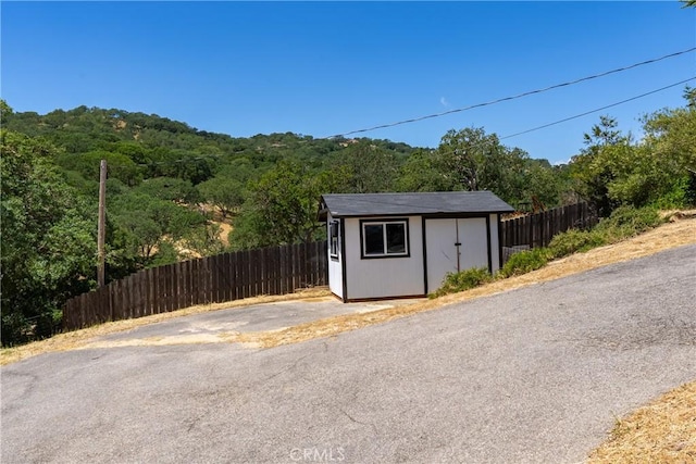 9900 Carmelita Ave, Atascadero, CA 93422 - view of shed featuring a wooded view