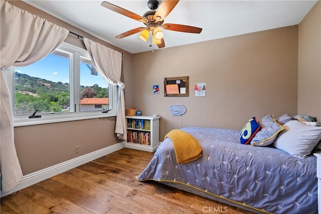 9900 Carmelita Ave, Atascadero, CA 93422 - bedroom with hardwood / wood-style flooring, baseboards, and a ceiling fan