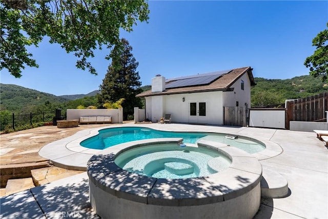 9900 Carmelita Ave, Atascadero, CA 93422 - view of pool with a mountain view, french doors, a pool with connected hot tub, a patio, and a fenced backyard