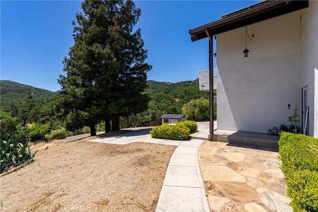 9900 Carmelita Ave, Atascadero, CA 93422 - view of yard with a patio area and a forest view