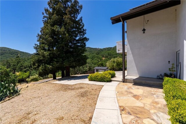 9900 Carmelita Ave, Atascadero, CA 93422 - view of yard with a patio area and a view of trees