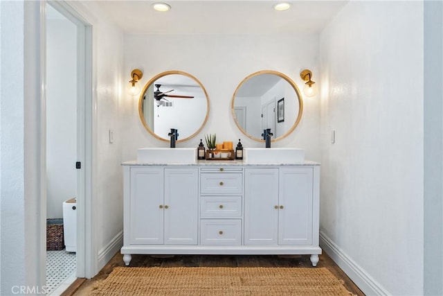 9900 Carmelita Ave, Atascadero, CA 93422 - full bathroom with wood finished floors, baseboards, a ceiling fan, double vanity, and recessed lighting