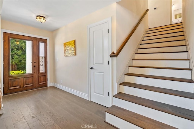 9900 Carmelita Ave, Atascadero, CA 93422 - foyer featuring stairs, wood finished floors, and baseboards