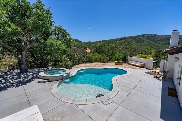9900 Carmelita Ave, Atascadero, CA 93422 - view of swimming pool featuring a patio, a view of trees, a pool with connected hot tub, and a mountain view