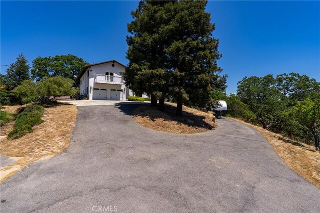 9900 Carmelita Ave, Atascadero, CA 93422 - view of front of house with driveway and an attached garage