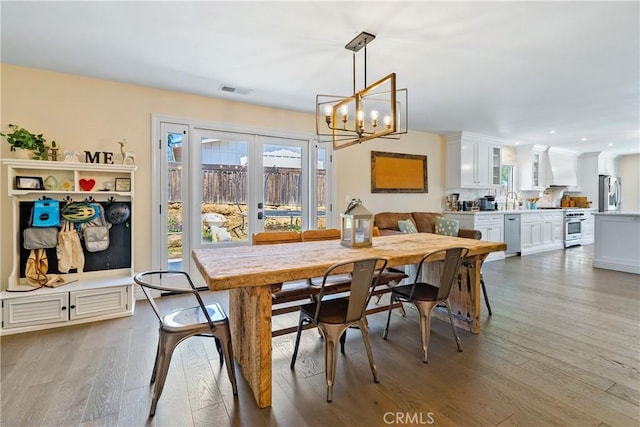 9900 Carmelita Ave, Atascadero, CA 93422 - dining room featuring a chandelier, light wood-style flooring, and recessed lighting