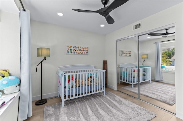 3094 Windemere Ct, Chino Hills, CA 91709 - bedroom with a nursery area, wood finished floors, a closet, baseboards, and ceiling fan