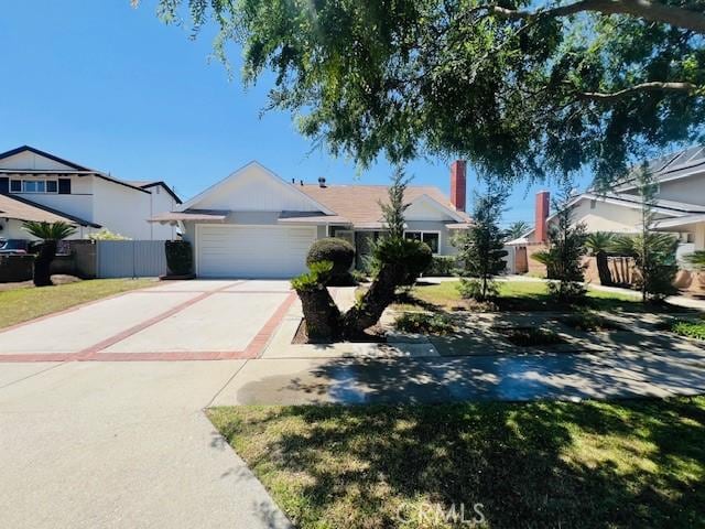 239 N Basilio Ave, San Dimas, CA 91773 - view of front facade with a garage and driveway
