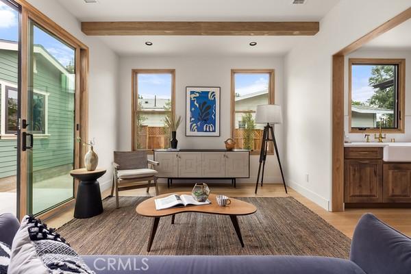 4958 Highland View Ave, Los Angeles, CA 90041 - living room featuring light wood-type flooring, healthy amount of natural light, baseboards, beamed ceiling, and recessed lighting