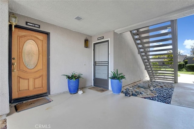 8866 Tulare Dr Unit 301C, Huntington Beach, CA 92646 - doorway to property with stucco siding