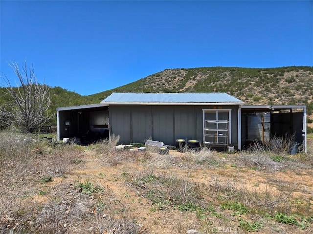 36255 Grapevine Canyon Rd, Ranchita, CA 92066 - view of side of home with board and batten siding, a mountain view, an outbuilding, and a pole building