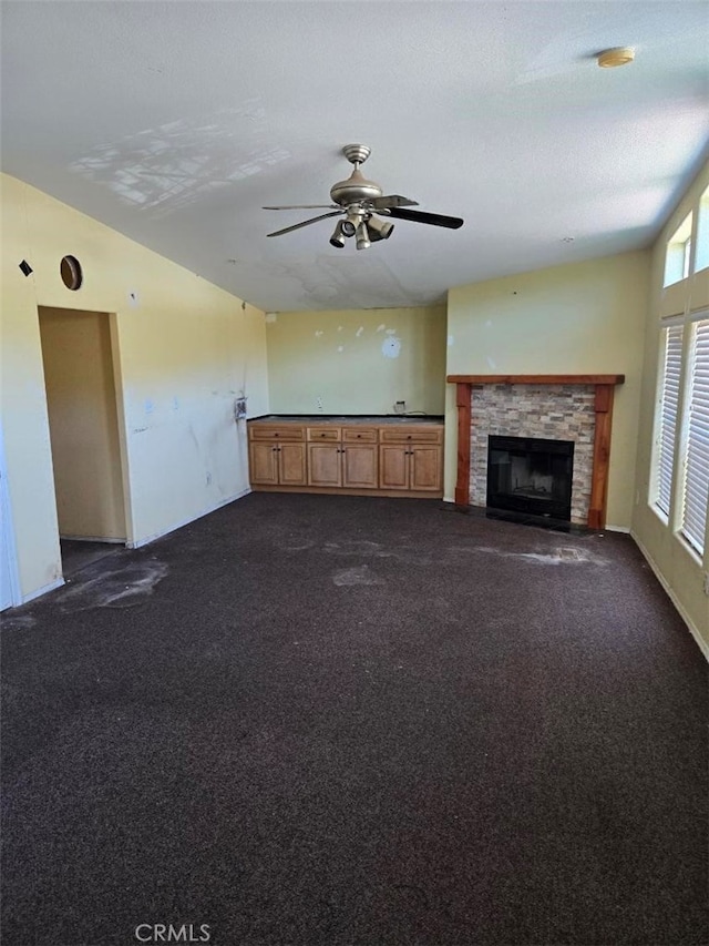 36255 Grapevine Canyon Rd, Ranchita, CA 92066 - unfurnished living room featuring dark carpet, ceiling fan, and a fireplace