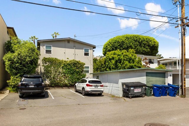 102733 3rd St, Encinitas, CA 92024 - view of front of home featuring uncovered parking and stucco siding