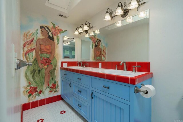 398 Aliso St, Ventura, CA 93001 - full bath with double vanity and tasteful backsplash