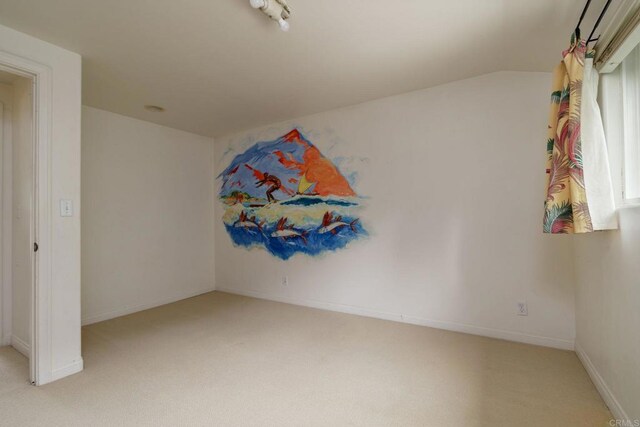 398 Aliso St, Ventura, CA 93001 - carpeted empty room featuring baseboards and lofted ceiling