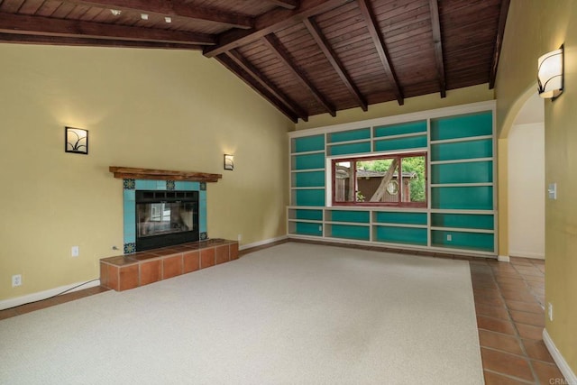 398 Aliso St, Ventura, CA 93001 - unfurnished living room with wooden ceiling, a tile fireplace, baseboards, arched walkways, and tile patterned floors