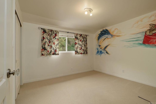 398 Aliso St, Ventura, CA 93001 - unfurnished bedroom featuring light colored carpet, baseboards, and a closet