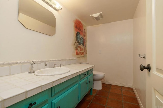 398 Aliso St, Ventura, CA 93001 - bathroom with vanity, toilet, baseboards, and tile patterned flooring