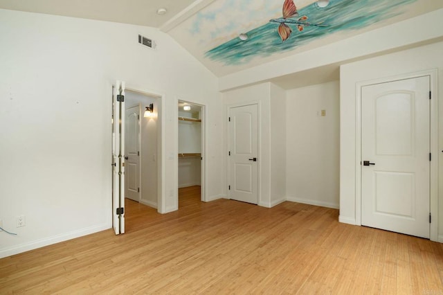 398 Aliso St, Ventura, CA 93001 - unfurnished bedroom with light wood-style flooring, lofted ceiling, baseboards, and a spacious closet