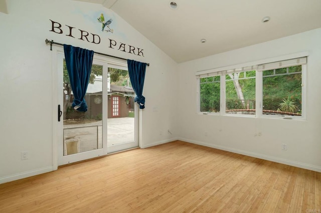 398 Aliso St, Ventura, CA 93001 - empty room featuring vaulted ceiling, wood finished floors, and baseboards