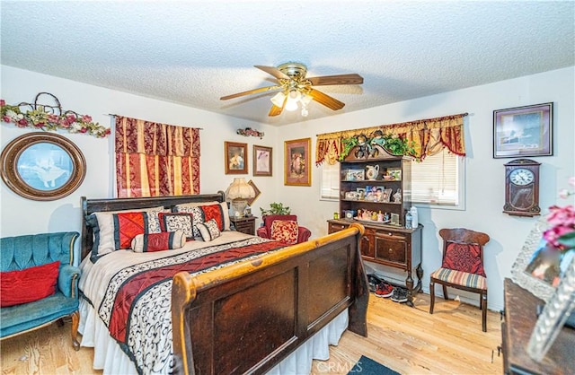 5011 Hedrick Ave, Riverside, CA 92505 - bedroom with light wood-style flooring, a textured ceiling, and ceiling fan