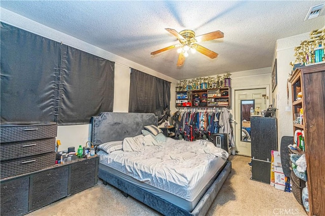5011 Hedrick Ave, Riverside, CA 92505 - bedroom with a textured ceiling, ceiling fan, and carpet
