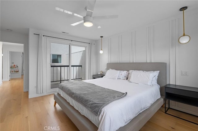 2410 Voorhees Ave Unit 3, Redondo Beach, CA 90278 - bedroom featuring light wood-style floors, access to outside, ceiling fan, a decorative wall, and baseboards
