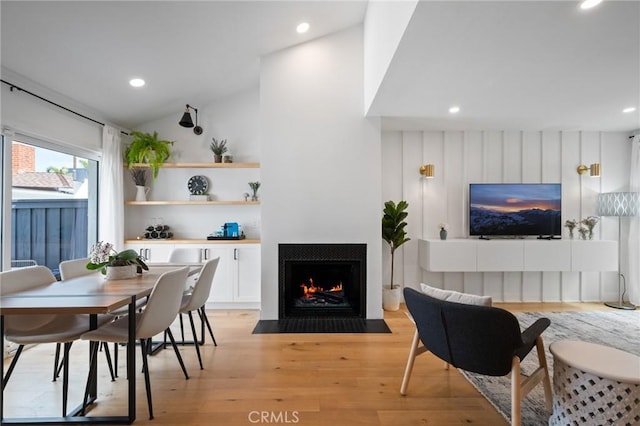 2410 Voorhees Ave Unit 3, Redondo Beach, CA 90278 - dining room featuring a fireplace with flush hearth, light wood-style floors, recessed lighting, and lofted ceiling
