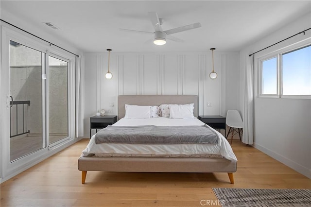 2410 Voorhees Ave Unit 3, Redondo Beach, CA 90278 - bedroom with light wood finished floors, access to outside, baseboards, and a ceiling fan
