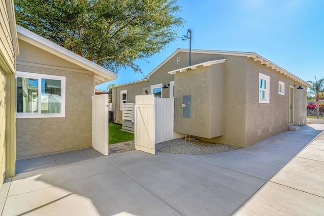 444547 N 42nd St, San Diego, CA 92116 - view of property exterior featuring stucco siding and a patio