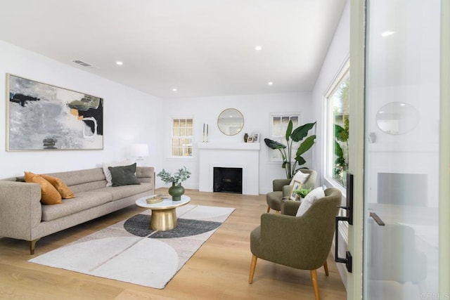 444547 N 42nd St, San Diego, CA 92116 - living room featuring healthy amount of natural light, wood finished floors, a fireplace, and recessed lighting