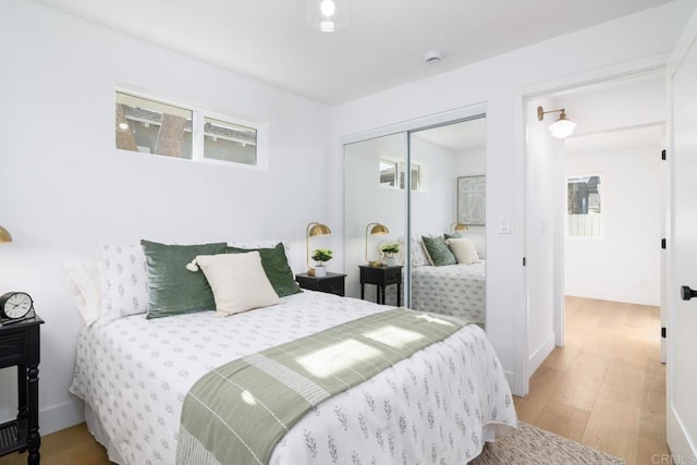 444547 N 42nd St, San Diego, CA 92116 - bedroom featuring wood finished floors, a closet, and baseboards