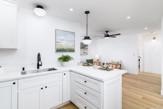 444547 N 42nd St, San Diego, CA 92116 - kitchen with a sink, a peninsula, ceiling fan, white cabinetry, and recessed lighting