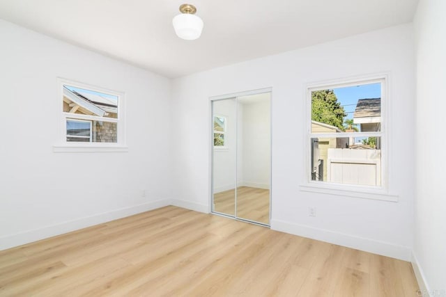 444547 N 42nd St, San Diego, CA 92116 - unfurnished bedroom with wood finished floors, baseboards, and a closet
